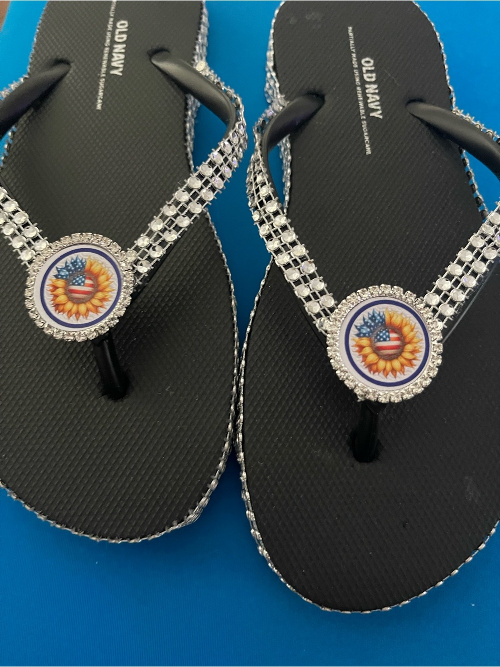 Old Navy Black Flip Flops with Rhinestone Straps and Sunflower Medallion